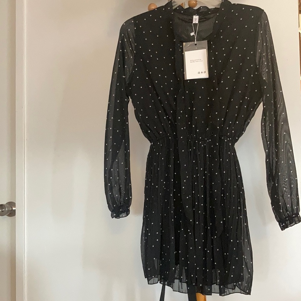 White polka dotted black dress